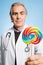 Doctor holding a lollipop