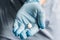 Doctor holding medical drugs, pills. hands in blue latex gloves