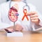 Doctor holding Orange ribbon with kidney Adrenal gland model. Kidney Cancer Awareness March month, disease of Urinary system and