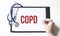 Doctor holding a paper plate with text COPD, medical concept