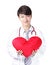 Doctor holding a red love heart pillow