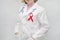 Doctor holding red ribbon. AIDS, HIV