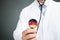 Doctor Holding Stethoscope With German Flag On Chestpiece