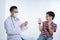 doctor holding a syringe with injection vaccination. Boy is afraid. Teen boy in fear of injection. office on white background