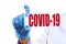 Doctor holding a vaccine against the virus COVID-19 . Anti COVID-19 vaccine concept - Image