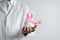 Doctor holding virtual pink ribbon cancer, Breast cancer awareness