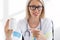 Doctor holding white unlabeled medicine pills bottle