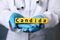 Doctor holding yellow cubes with word Candida, closeup