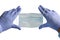 Doctor holds antivirus face mask in hands in blue medical gloves on white background. Countering the virus. Medical masks cover