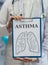 Doctor holds clipboard with asthma diagnosis and lungs drawing