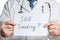 Doctor holds a clipboard with still smoking label