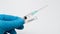 Doctor holds COVID 19 Coronavirus vaccine in his hand, infected blood sample in the sample tube, Vaccine and syringe injection It