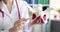 Doctor holds model of pelvic bone closeup