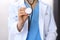 Doctor holds stethoscope head, closeup. Physician ready to examine and help patient. Medical help and insurance in