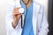 Doctor holds stethoscope head, closeup. Physician ready to examine and help patient. Medical help and insurance in