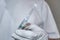 Doctor holds a syringe with medicine in his hands. Hospital medical care. Coronavirus vaccine