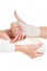 Doctor imposes an elastic bandage to the patient\'s hand