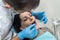 Doctor inspecting patient`s teeth with mirror close up