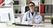 Doctor with large clock stretching bottle of water on camera.