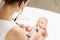 Doctor listening heartbeat of newborn baby by stethoscope