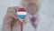 Doctor listening with the stethoscope with flag of Luxembourg. Luxembourgian healthcare