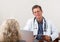 Doctor Listening to Female Patient in Office