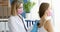 Doctor listens to patient through stethoscope, examines heartbeat lungs of woman