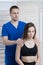 The doctor makes a diagnosis of the shoulder and elbow joint for the girl. The chiropractor checks the tone of the woman`s