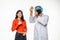 Doctor man expert inject shoulder covid antidote vaccine woman raise thumb up wear mask hood uniform plastic facial protection