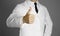 Doctor. A man in a white coat, white shirt and black tie gives a thumbs up. Without a face