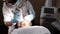 The doctor in a mask conducts a procedure of laser face polishing