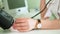 Doctor measuring blood pressure of woman in hospital 4k