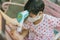 Doctor measuring temperature cute baby boy at hospital . Mother takes temperature for baby boy with Infrared Forehead Thermometer