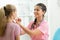 Doctor medic examining teenage patient girl in hospital office, Healthcare concept.