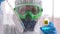 Doctor microbiologist virologist researcher scientist in laboratory in blue gloves, PPE biological hazard analyzing lab