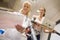 Doctor Monitoring Female Patient On Treadmill