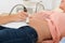 Doctor Moving Ultrasound Probe On Pregnant Woman`s Stomach