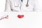 Doctor next to a red heart. Heart checkup. Health care. World heart day