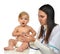 Doctor or nurse auscultating child baby patient heart with stethoscope physical therapy