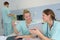 Doctor and nurse chatting in modern hospital canteen