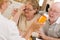 Doctor or Nurse Explaining Prescription Medicine to Senior Couple