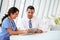 Doctor And Nurse Having Informal Meeting In Hospital Canteen