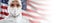 Doctor or Nurse In Hazmat Medical Personal Protective Equipment PPE Against The American Flag Banner