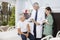 Doctor And Nurse Looking At Senior Patient At Rehab Center