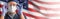 Doctor or Nurse In  Medical Personal Protective Equipment PPE Against The American Flag Banner