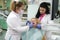 Doctor and nurse prepare female patient for dental procedure