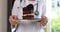 Doctor nutritionist holding piece of cake in hands closeup 4k movie slow motion