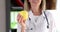 Doctor nutritionist therapist holds yellow apple