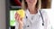 Doctor nutritionist therapist holds yellow apple