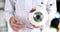 Doctor ophthalmologist showing anatomical structure of eye on mockup closeup 4k movie slow motion